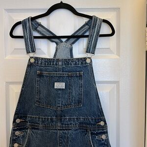 Medium dark wash Levi’s denim overalls